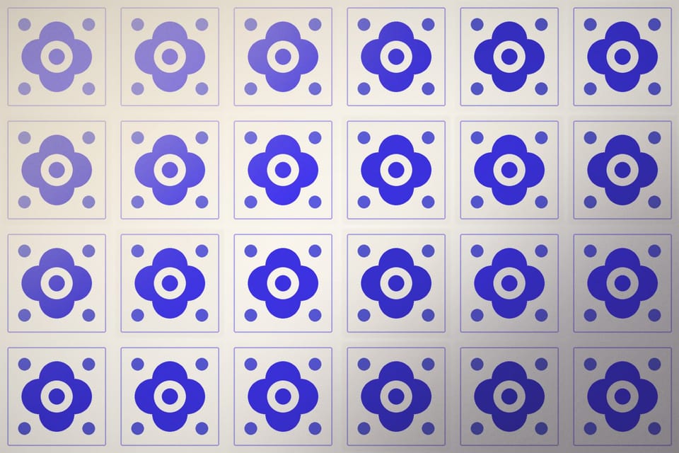 Close-up of hand-painted blue and white ceramic tiles